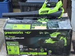 Greenworks 2516402 40V 21" Self Propelled Mower With Charger & Battery Plus Blow. Fixed Price $350.00.
