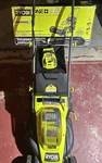 Ryobi One+ Hp 18V Brushless 16 In. Battery Push Lawn Mower, & Charger. Fixed Price $220.00.
