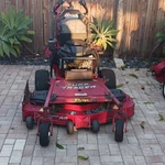 2 Exmark Turf Tracer Self-propelled Walk-behind Lawn Mower Red Electric Start. Fixed Price $1500.00.