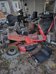 Red Snapper Riding Lown Mower. Fixed Price $300.00.